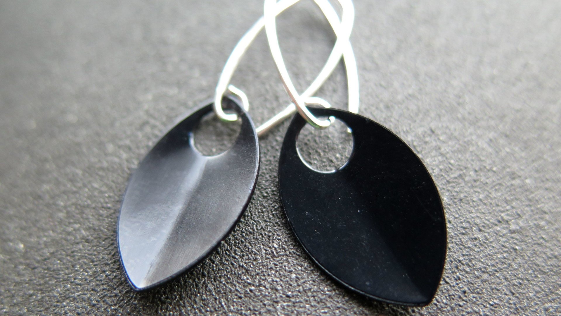 unique black dangle earring with gold earwires. modern anodized aluminum jewelry. splurge.