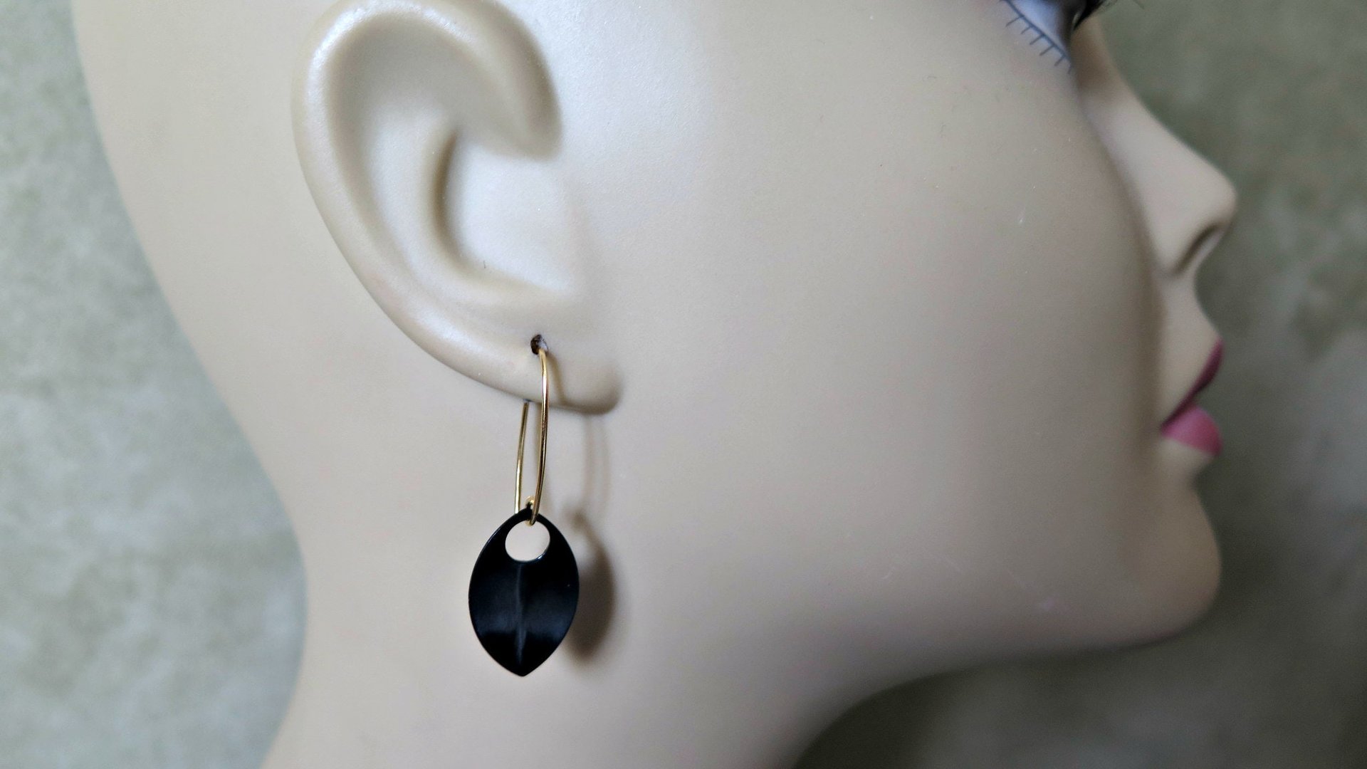unique black dangle earring with gold earwires. modern anodized aluminum jewelry. splurge.