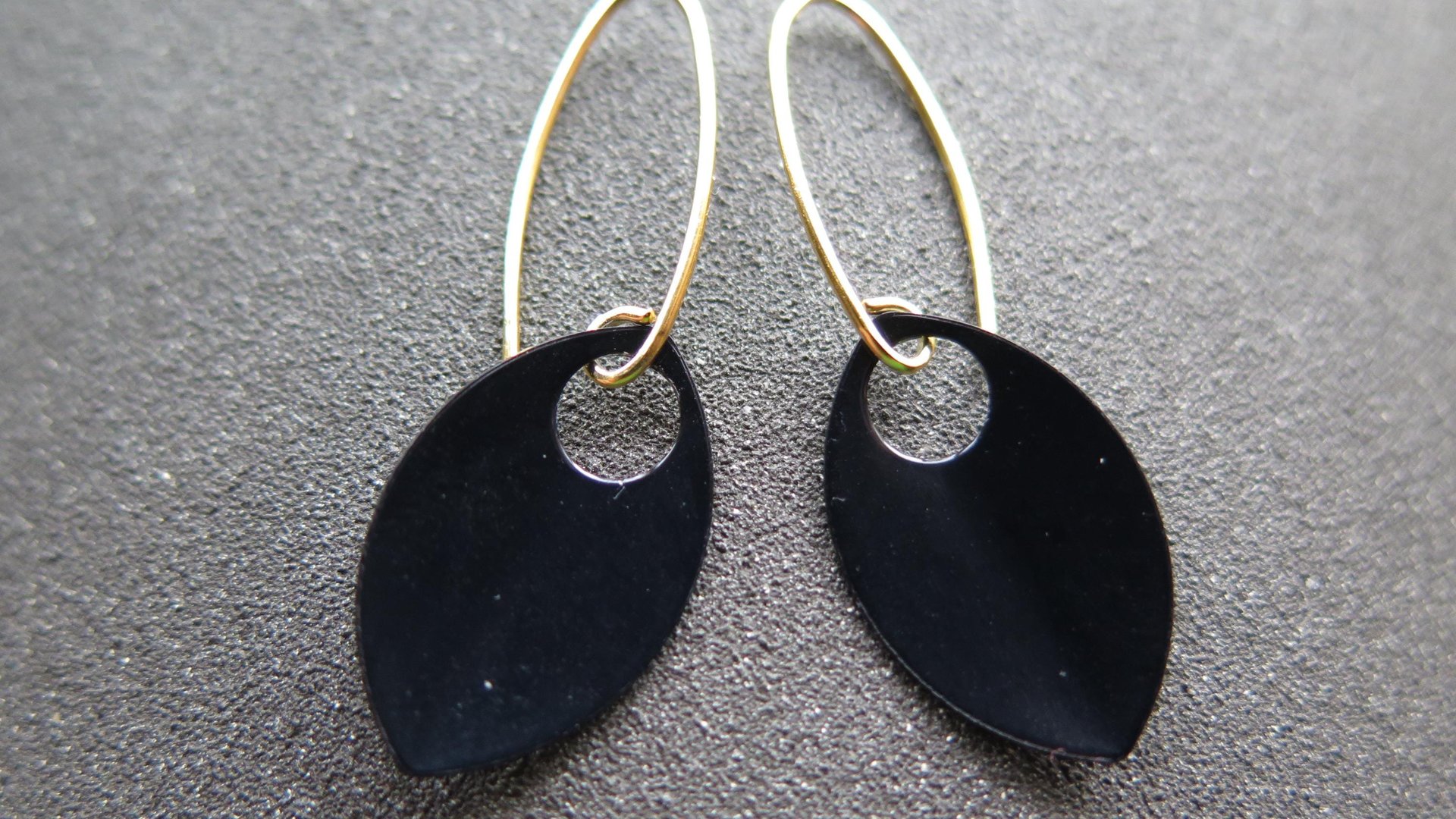 unique black dangle earring with gold earwires. modern anodized aluminum jewelry. splurge.