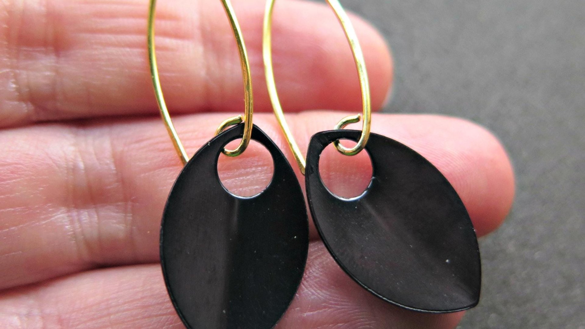 unique black dangle earring with gold earwires. modern anodized aluminum jewelry. splurge.