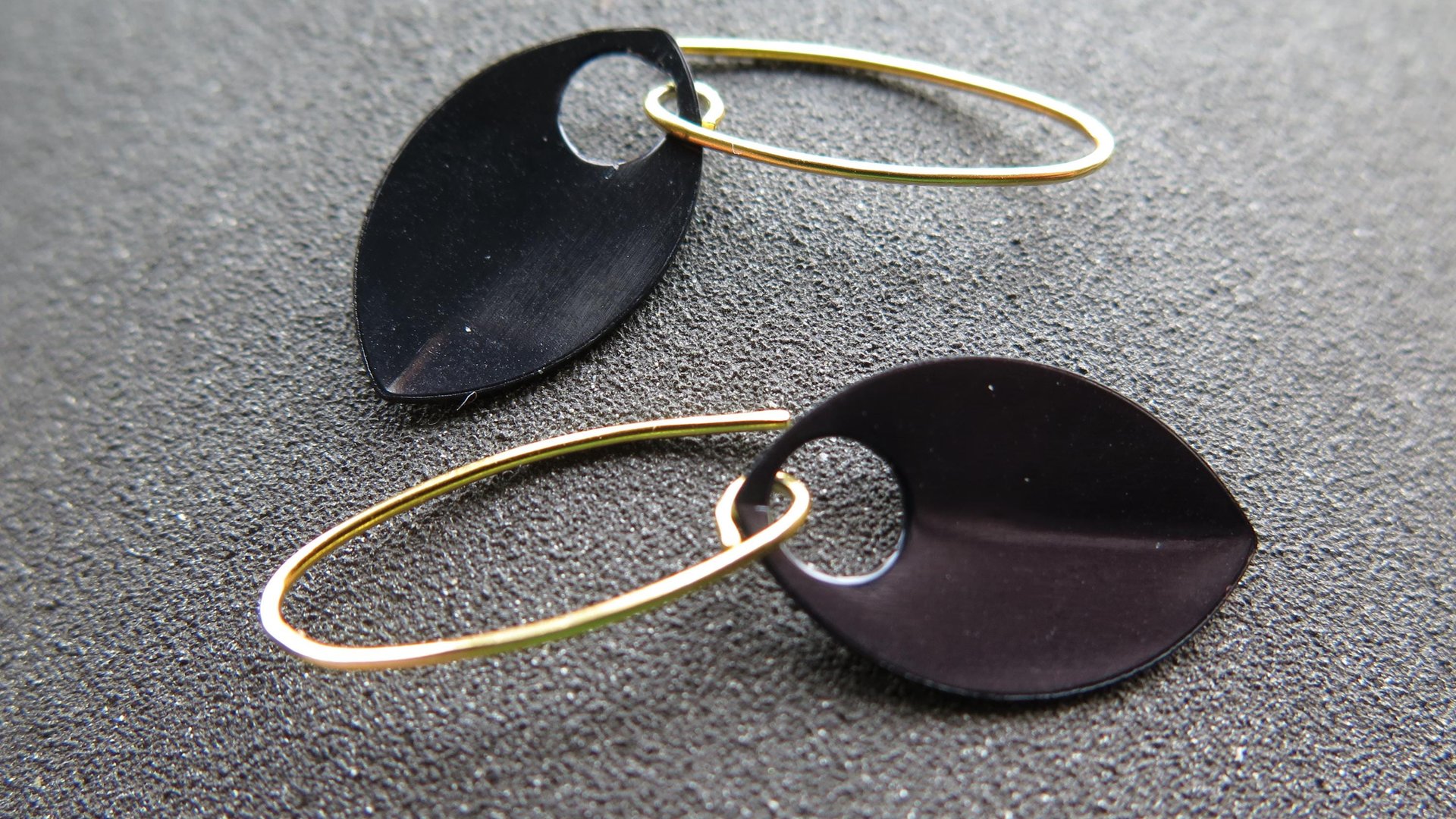 unique black dangle earring with gold earwires. modern anodized aluminum jewelry. splurge.