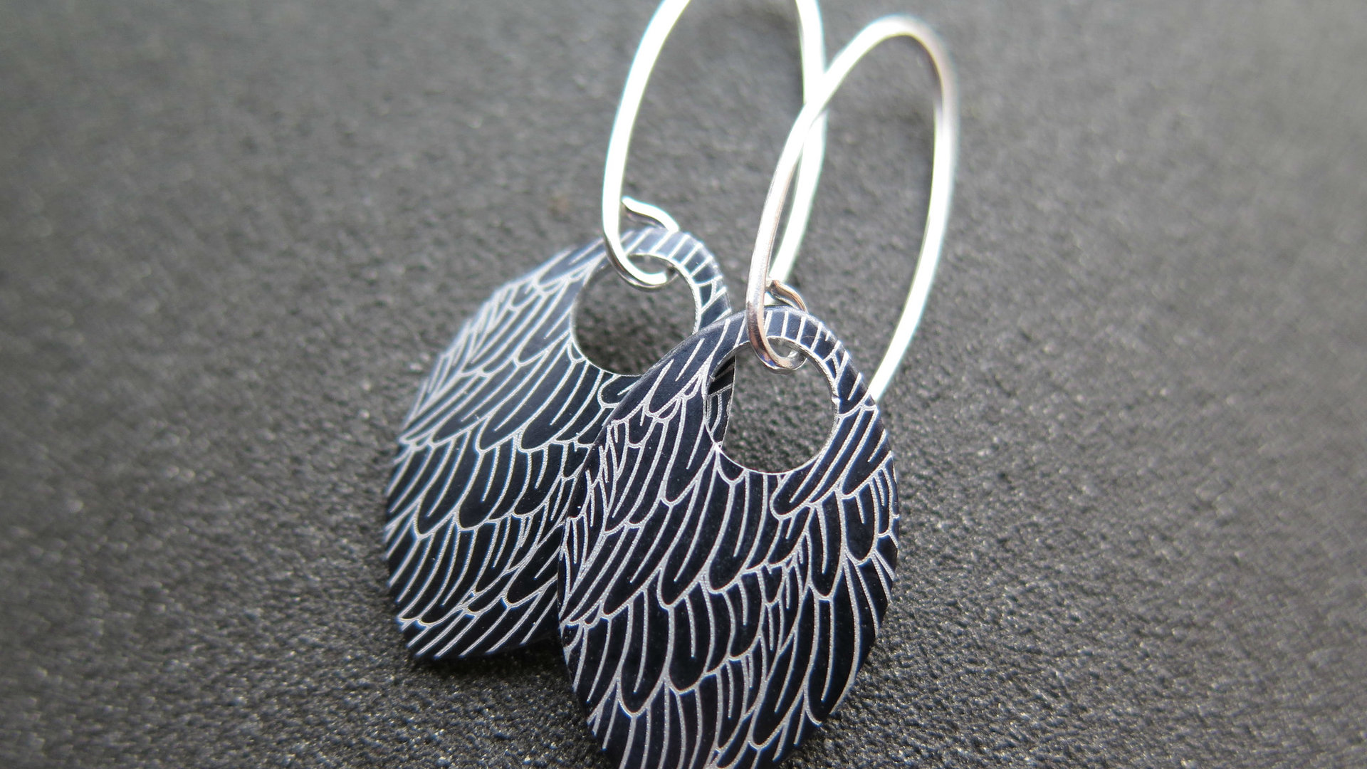 black wing earrings. anodized aluminum jewelry. sterling silver ear wire. splurge.