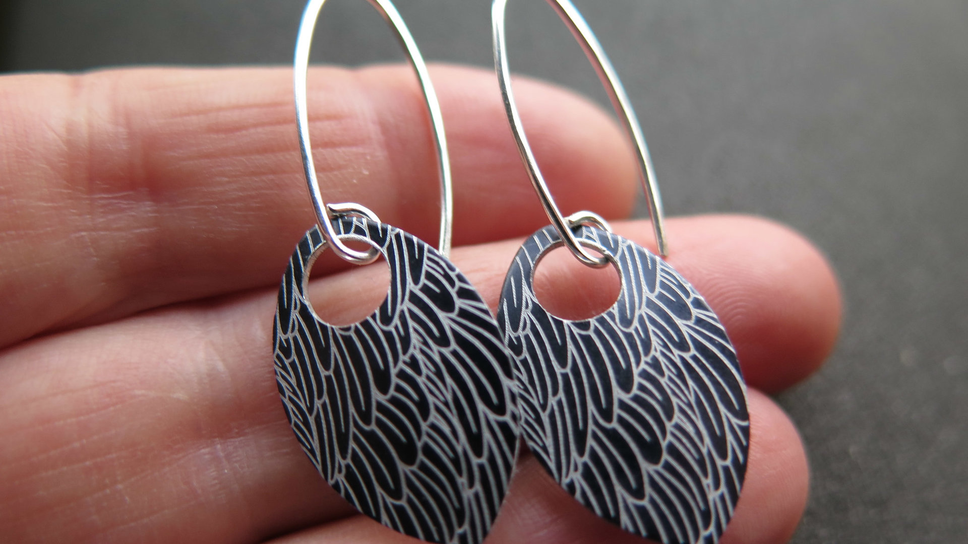 black wing earrings. anodized aluminum jewelry. sterling silver ear wire. splurge.