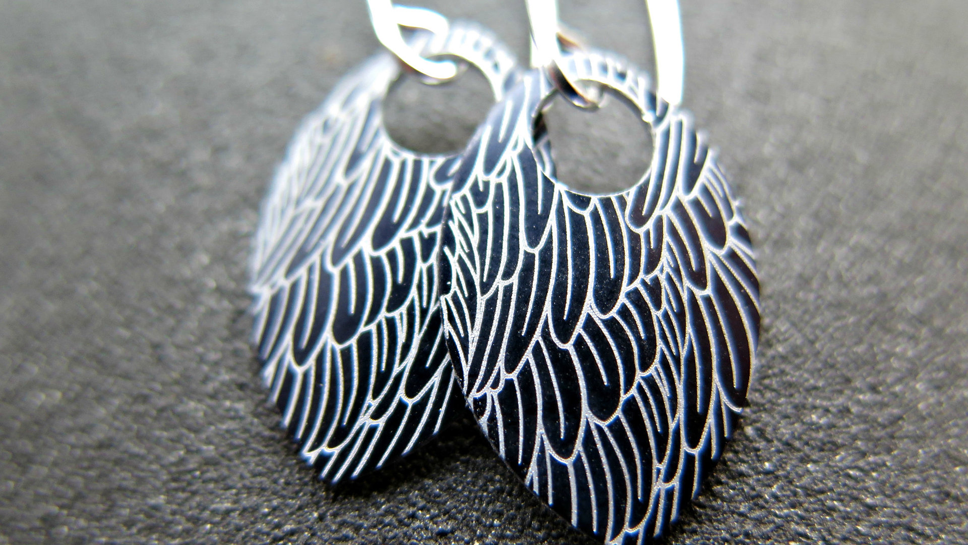 black wing earrings. anodized aluminum jewelry. sterling silver ear wire. splurge.