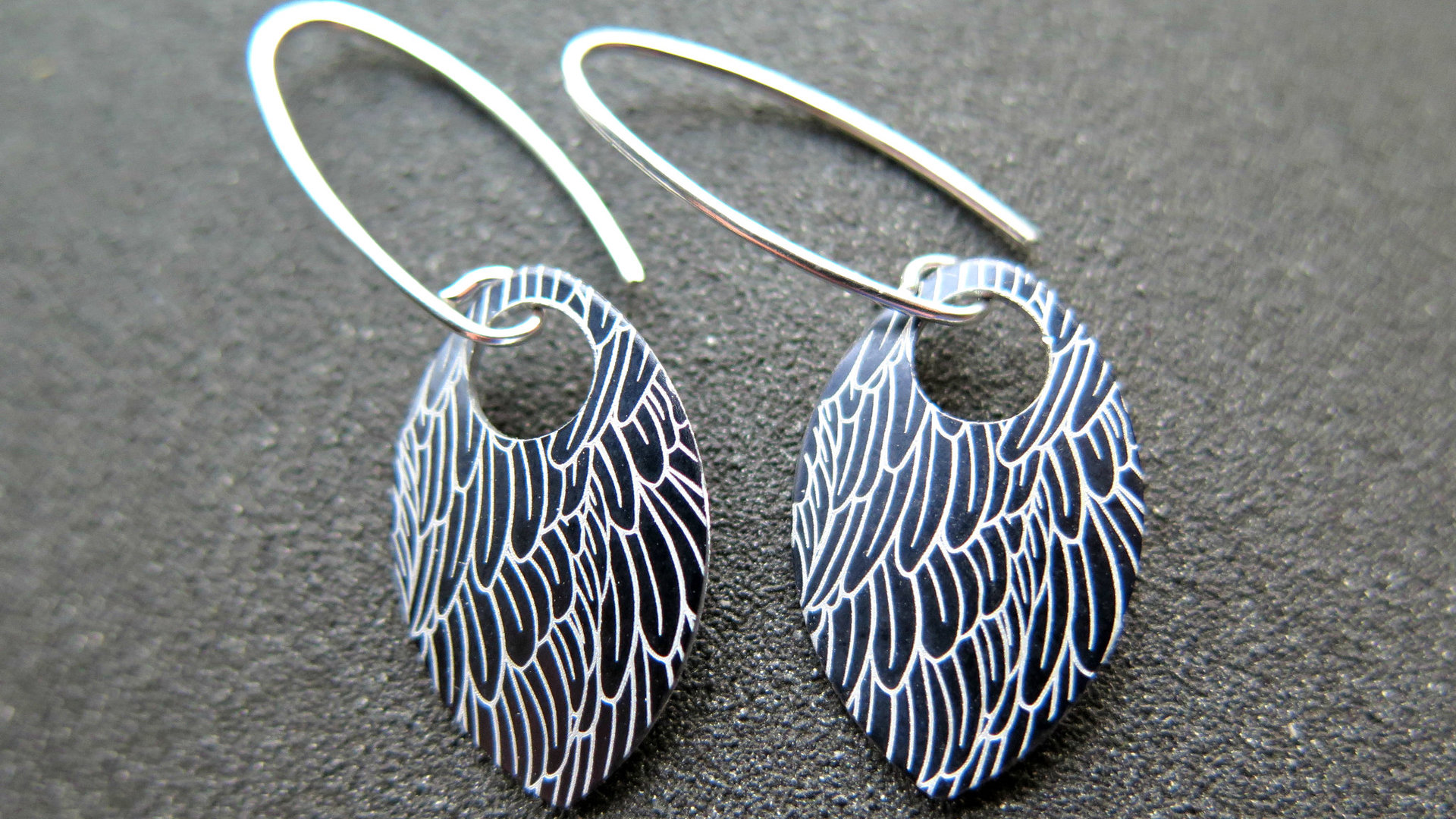 black wing earrings. anodized aluminum jewelry. sterling silver ear wire. splurge.