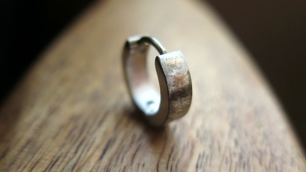 silver hoop earring for men. men's jewelry in brushed stainless steel.