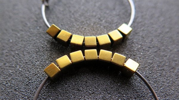 gold and silver earrings. hypoallergenic niobium hoops for sensitive ears.